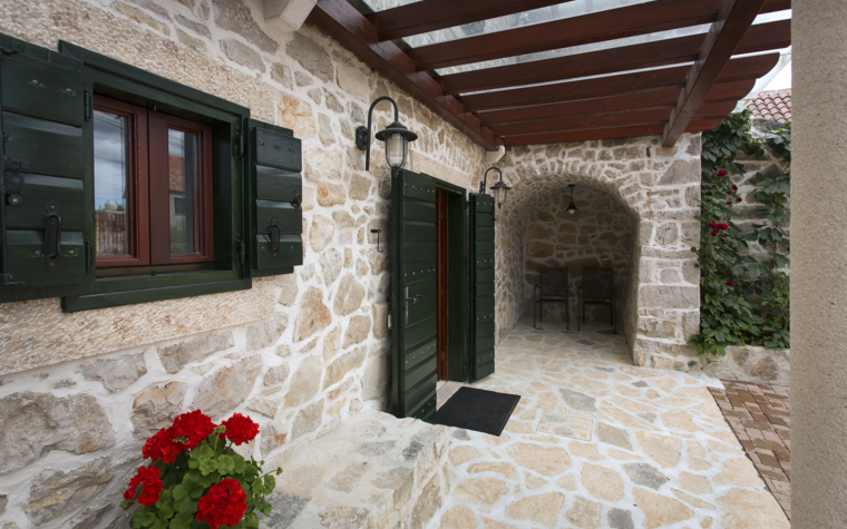 stone house entrance with covered terrace