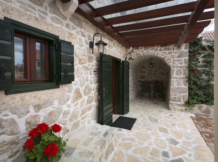 stone house entrance with covered terrace