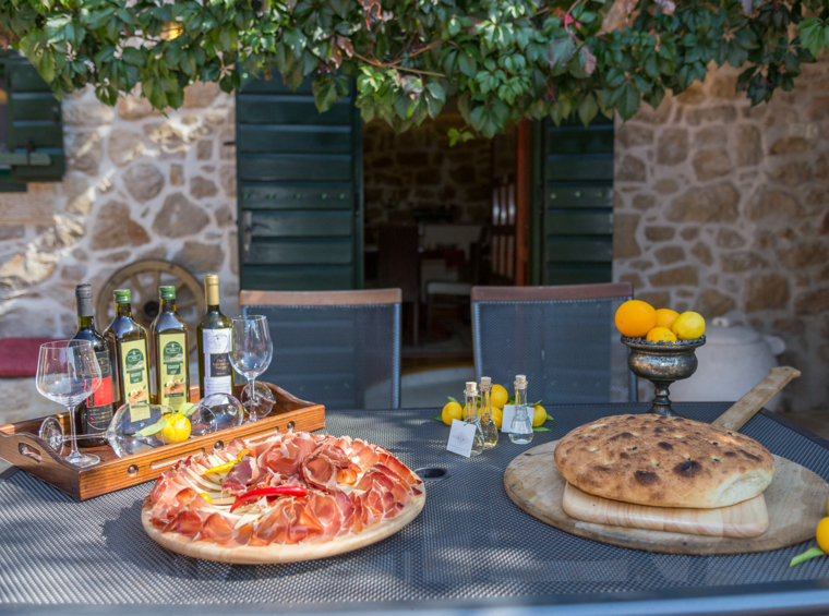 outdoor table with food and drinks in the villa courtyard