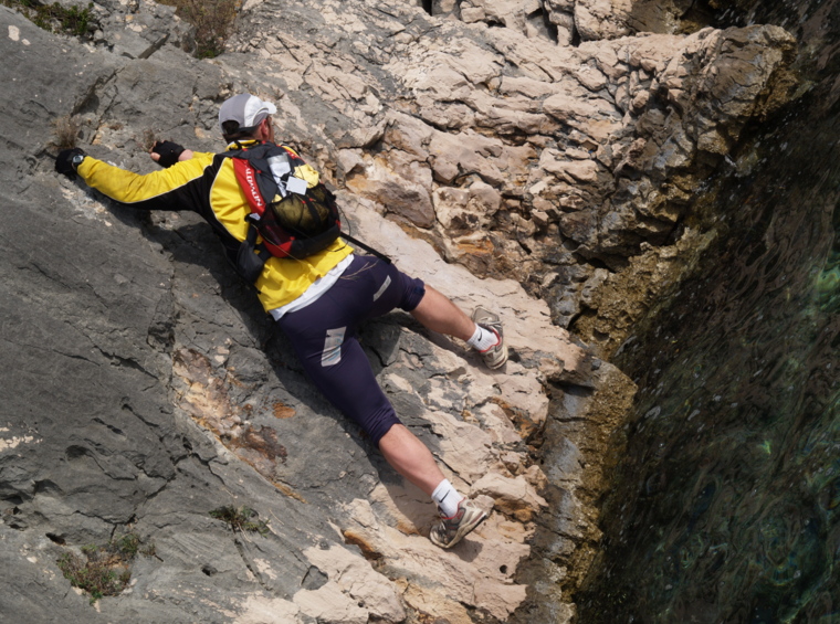 rock climber above the sea during an adventure activity