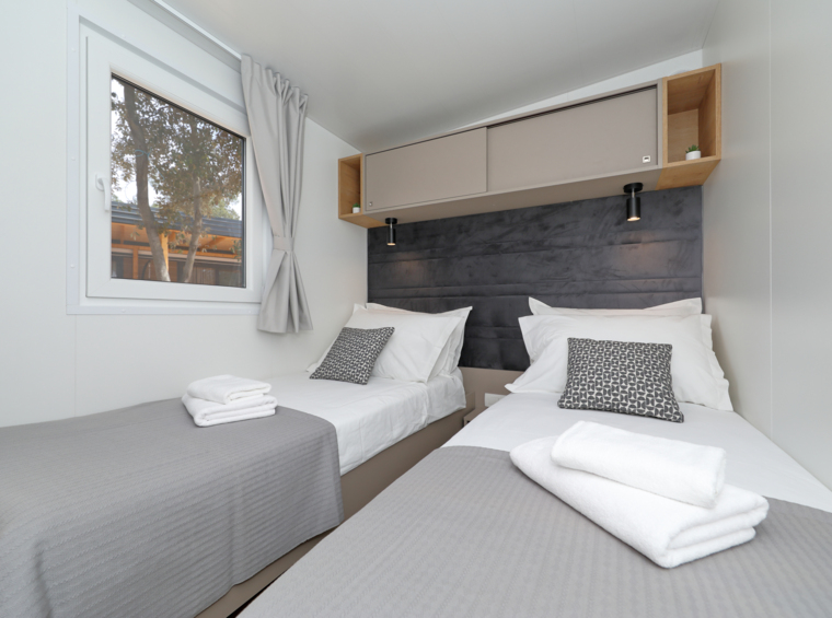 mobile home bedroom with two single beds