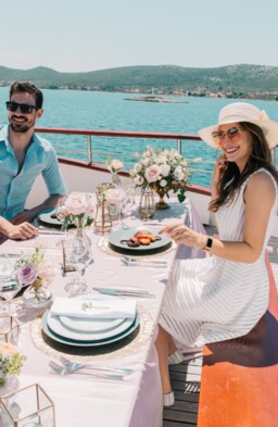 Couple enjoying a romantic meal on a yacht